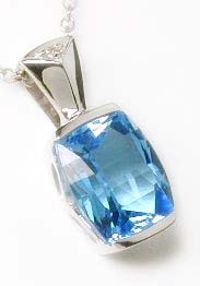 
Cushion-cut Blue Topaz and Diamond Pendant
