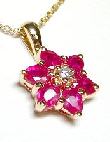 
Oval Ruby & Diamond Flower Pendant
