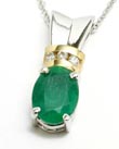
Elegant Two-tone 8x6mm Oval Emerald & Dia
